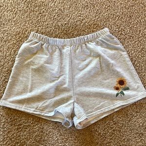 Light gray shorts with sunflower on front